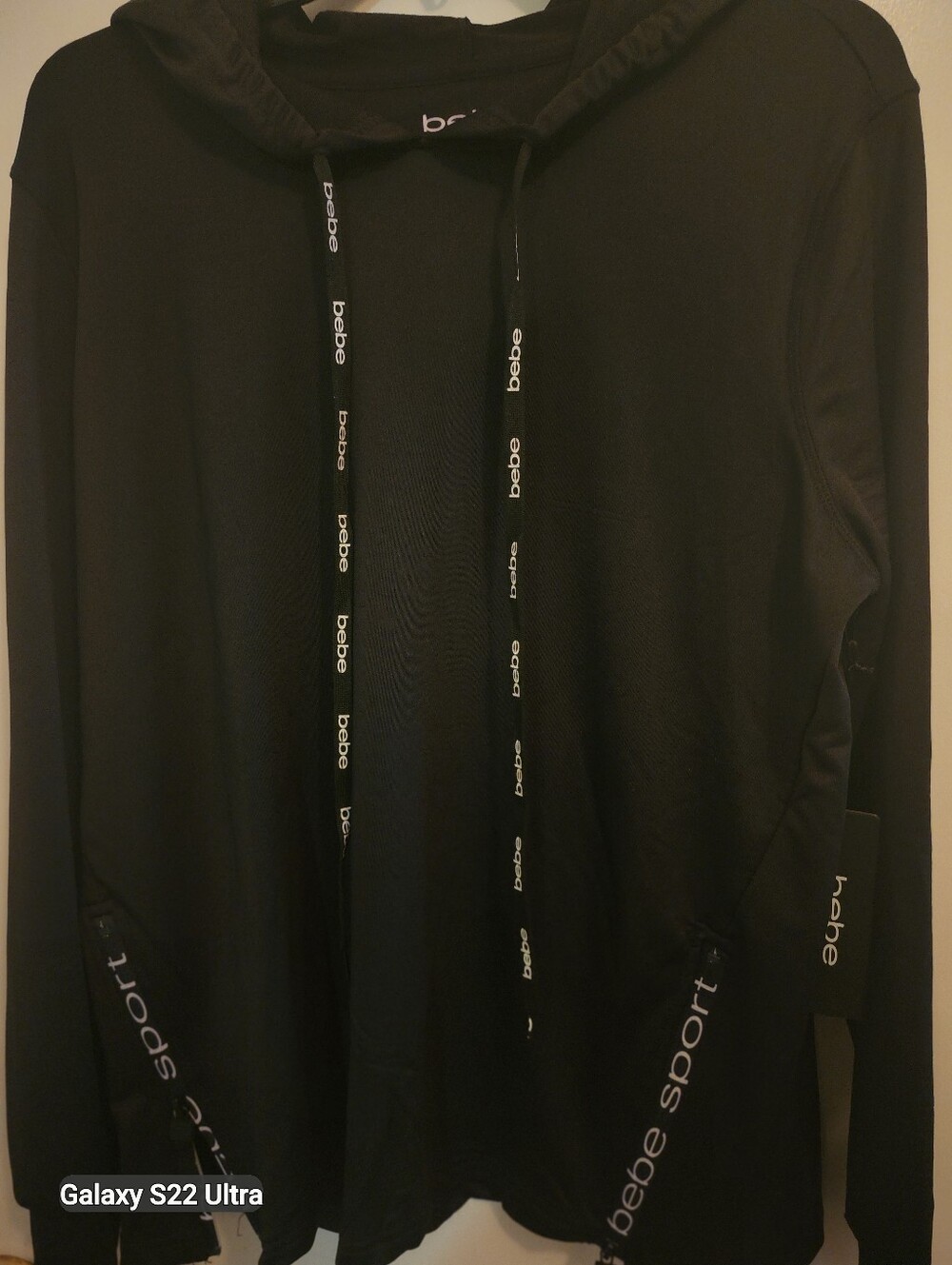 Bebe BNWT $99 BLACK SPORT HOODIE Size L. BeBe Strings, 2 Hem Zipper For Comfort